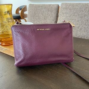 Micheal Kors crossbody handbag used purple/plum/wine color used good condition